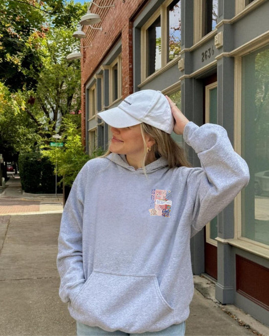 Woman wearing Fear God Not Man hoodie with God Tier collage design — Christian streetwear faith apparel.