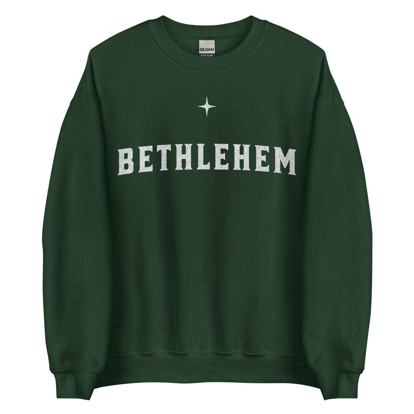 Woman wearing dark green Bethlehem Christian Christmas sweater with simple star design.