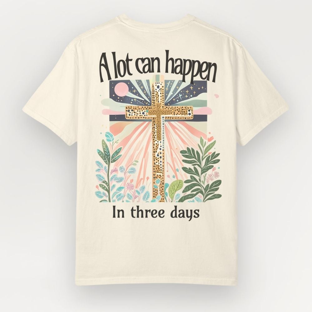 Beige t-shirt with a cross design and text on a light gray background