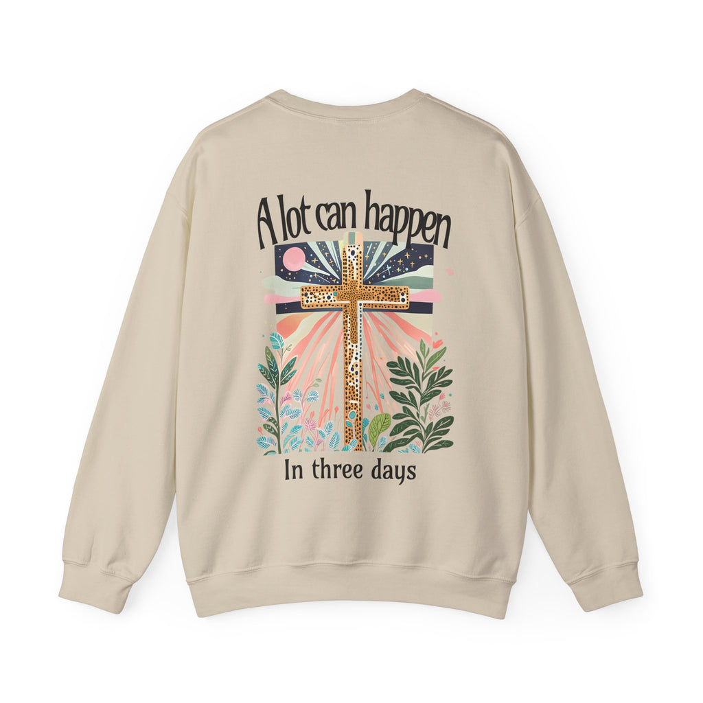 Beige sweatshirt with a cross and floral design on the back, featuring text.