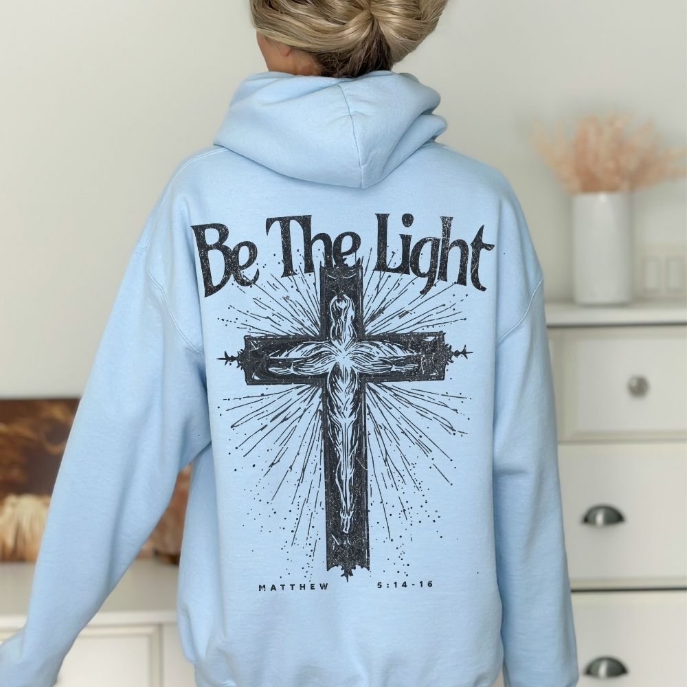 Light blue Christian hoodie with Be The Light cross design
