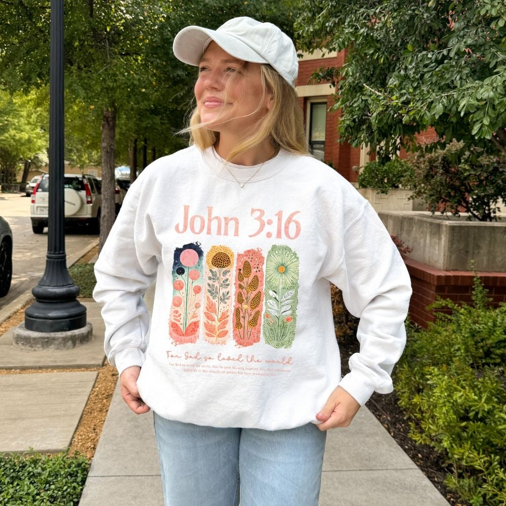 John 3:16 floral Christian sweatshirt worn outdoors
