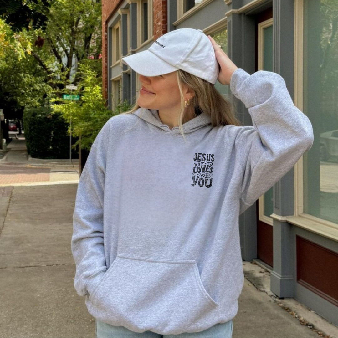 Unisex premium hoodie styled casually with a cap and streetwear look