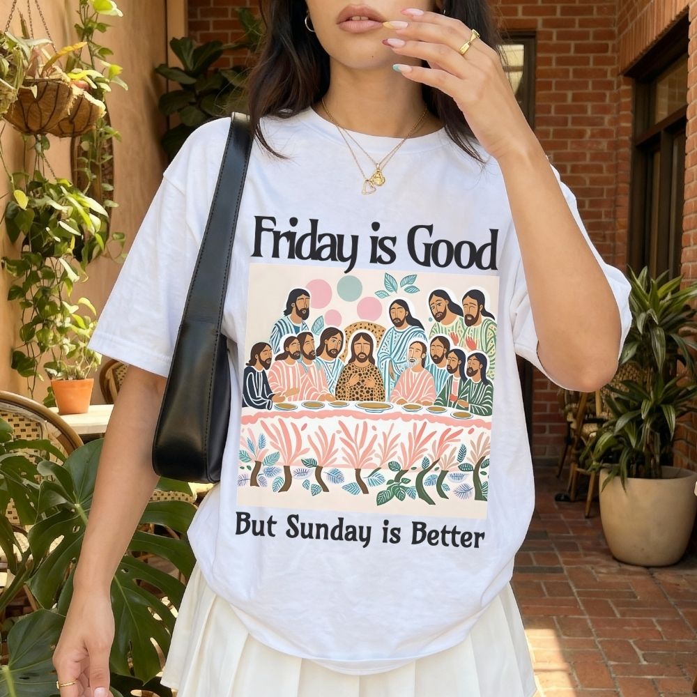 Person wearing a t-shirt with a graphic design and text outdoors.