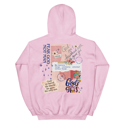 Woman wearing Fear God Not Man hoodie with God Tier collage design — Christian streetwear faith apparel.