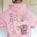 Back view of a pink faith-inspired hoodie with collage-style Christian design