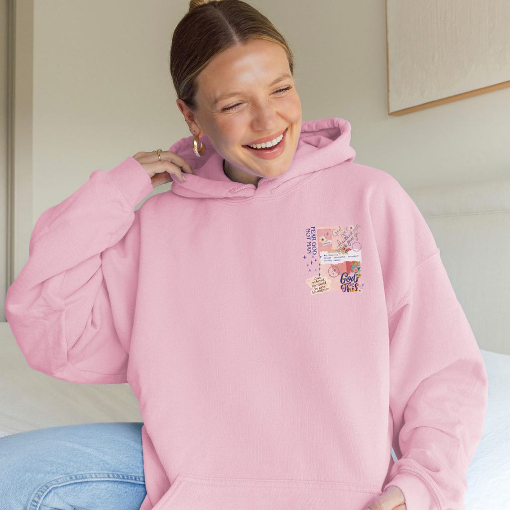 Front view of a pink faith-inspired hoodie with collage-style Christian design