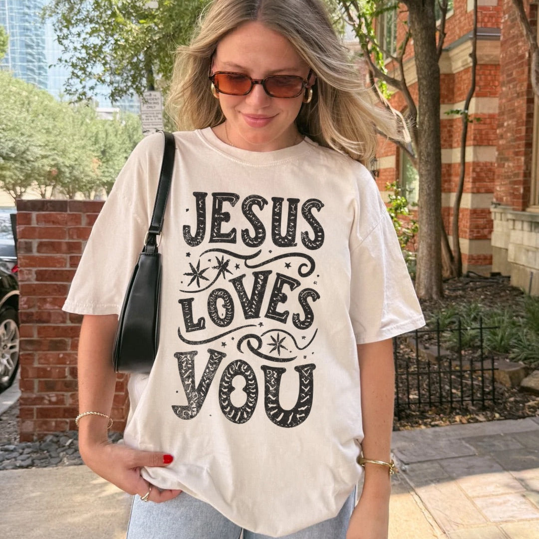 Woman wearing Jesus Loves You Christian t-shirt outdoors