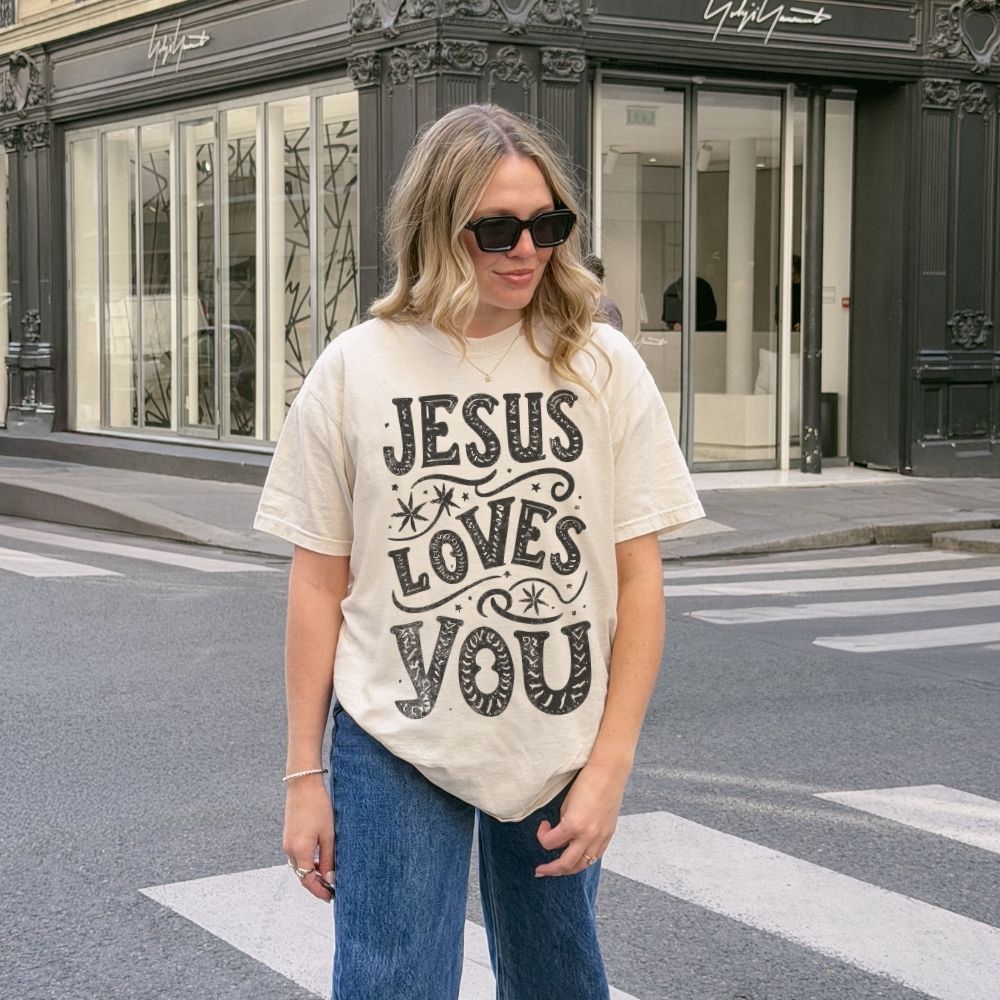 Woman wearing Jesus Loves You Christian t-shirt outdoors