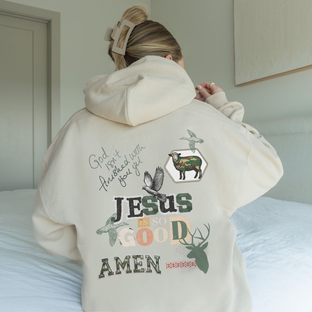 Person wearing a hoodie with religious text and graphics on the back.