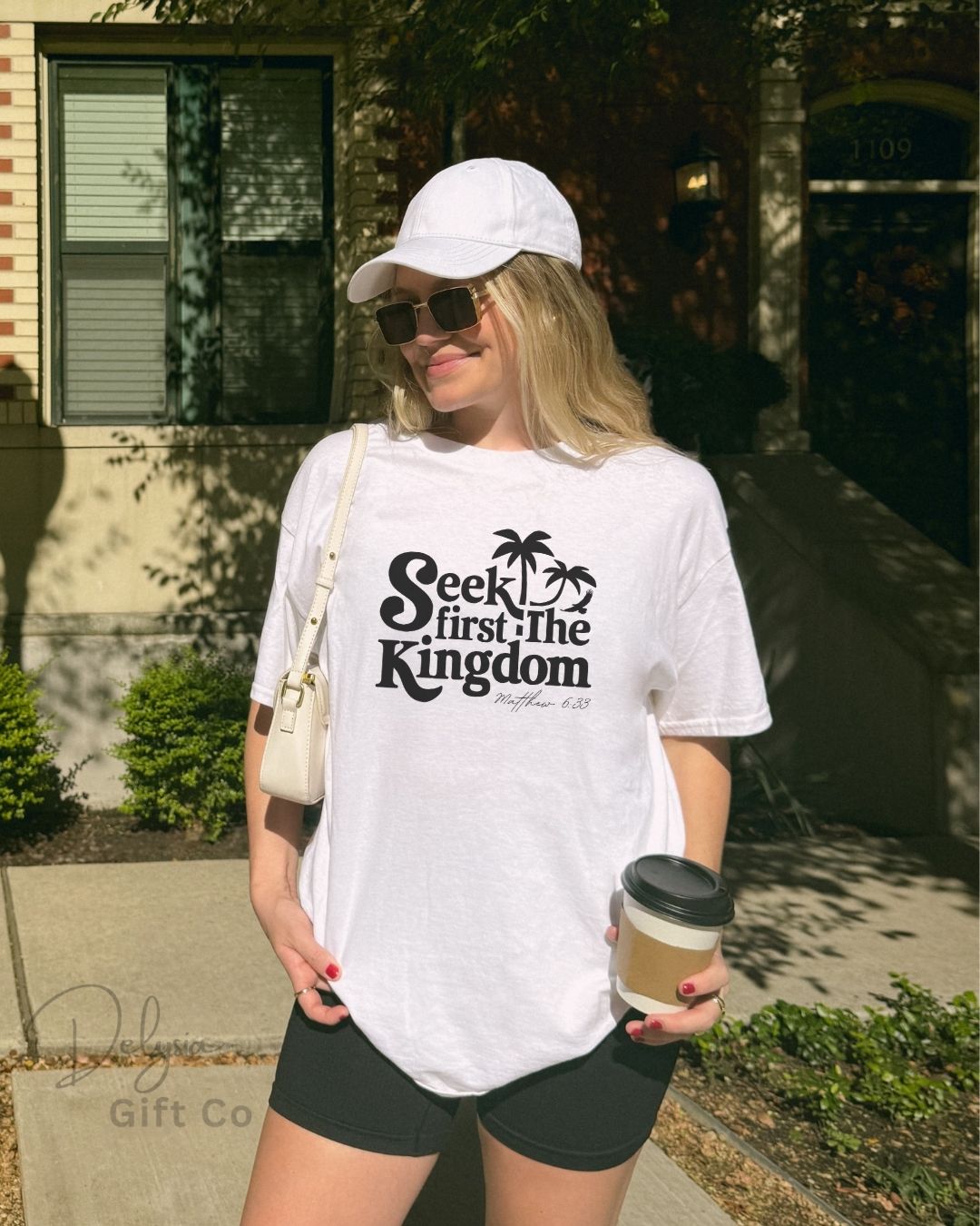 Woman wearing white Seek First the Kingdom Christian t-shirt outdoors