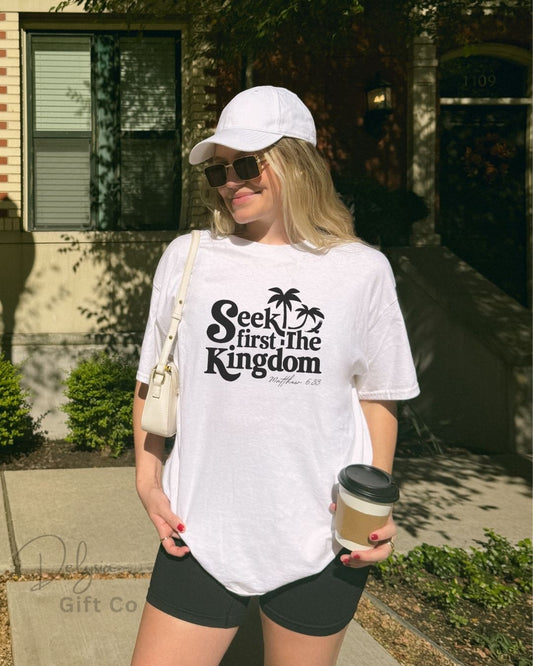 Woman wearing white Seek First the Kingdom Christian t-shirt outdoors