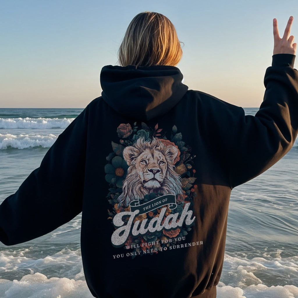 Back view of brown hoodie featuring Lion of Judah artwork with floral details and scripture inspired text
