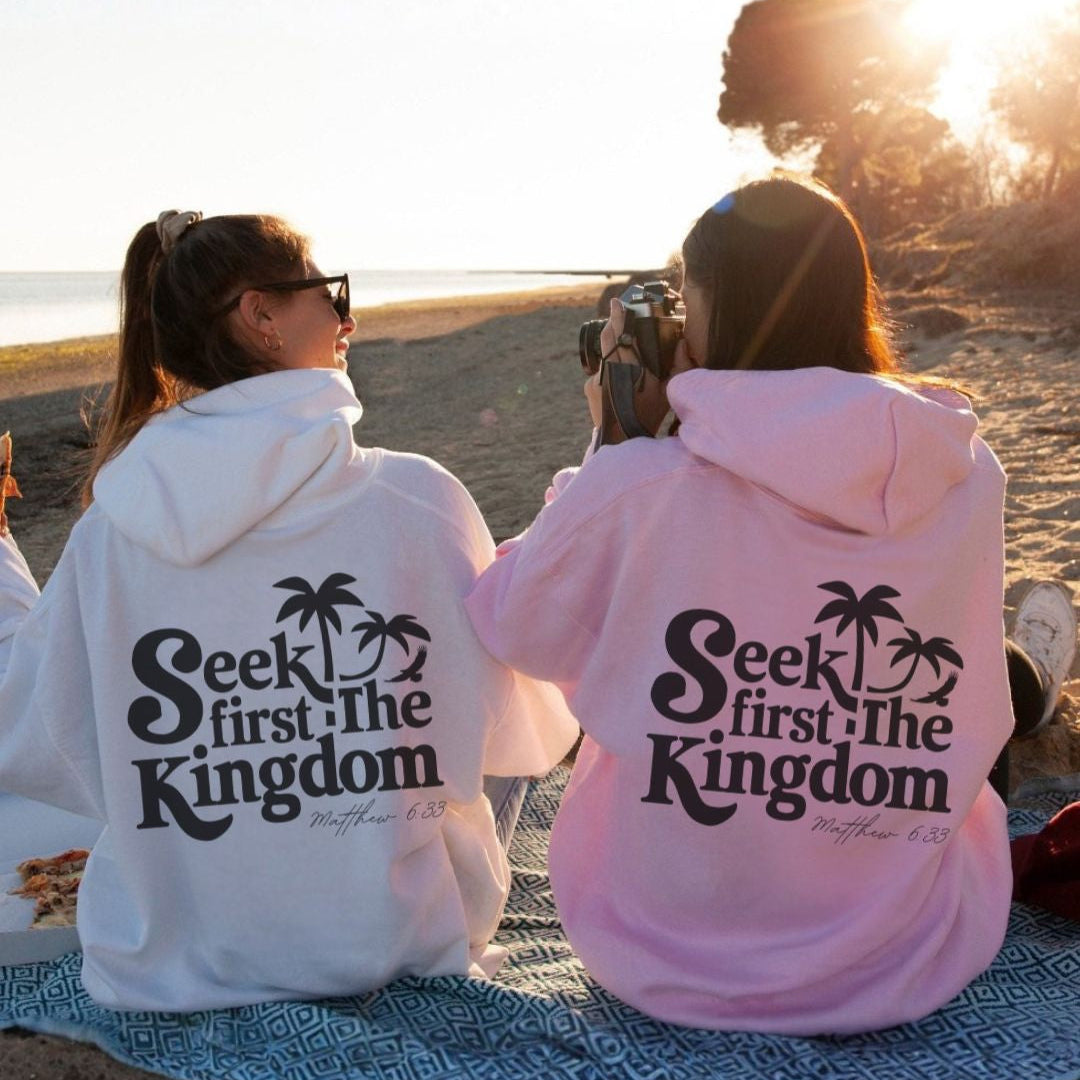 Back view of a pink faith-inspired hoodie with “Seek First the Kingdom” design