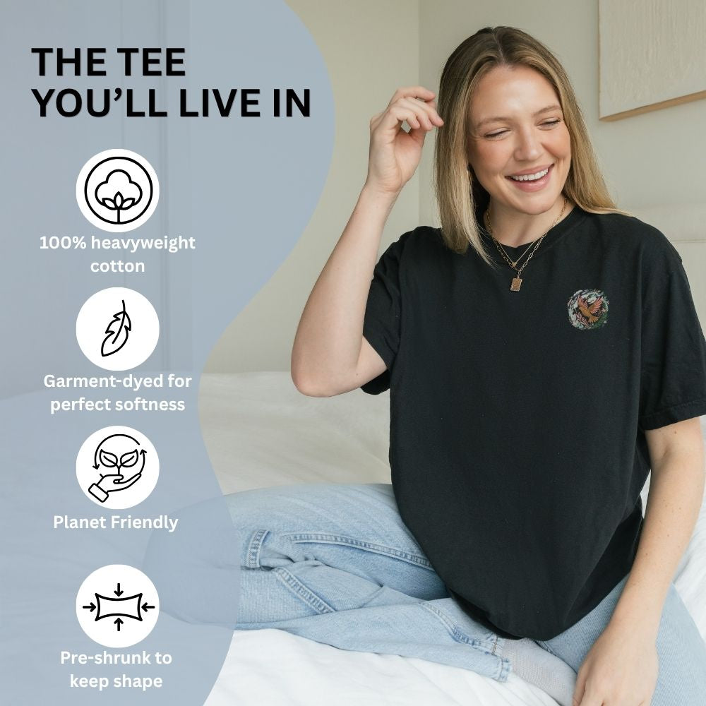 Woman wearing a black t-shirt with text and icons about the t-shirt's features.