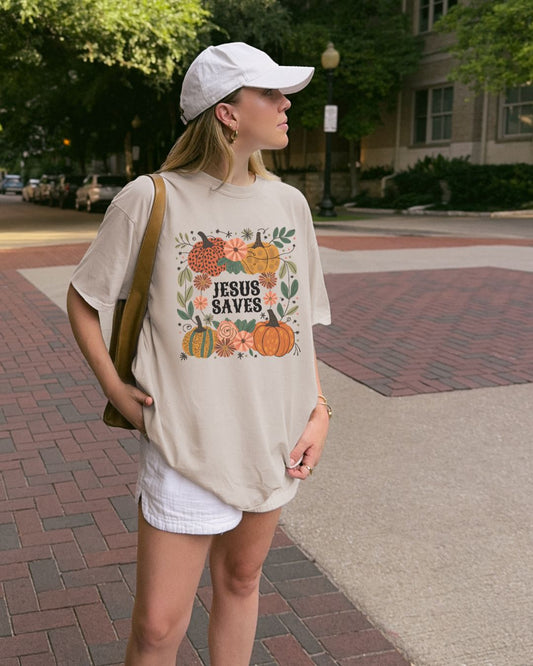 Woman wearing cream Jesus Saves Christian t-shirt outdoors