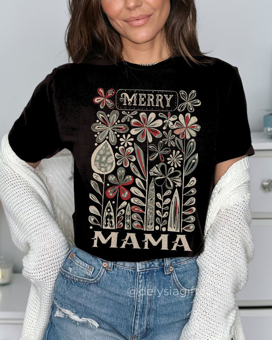 Woman wearing Merry Mama Christmas T-shirt — festive floral design for Christian mums celebrating Christmas.