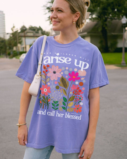 Woman wearing lilac Arise Up and Call Her Blessed Christian t-shirt