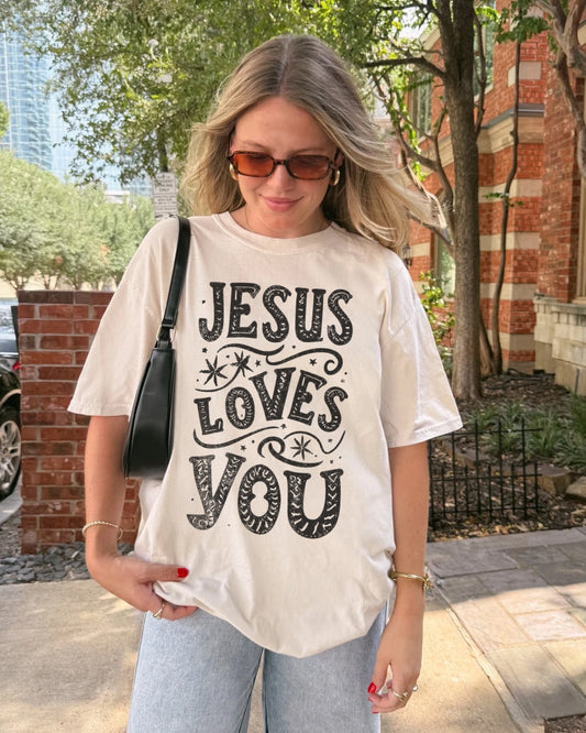 Woman wearing Jesus Loves You Christian t-shirt outdoors