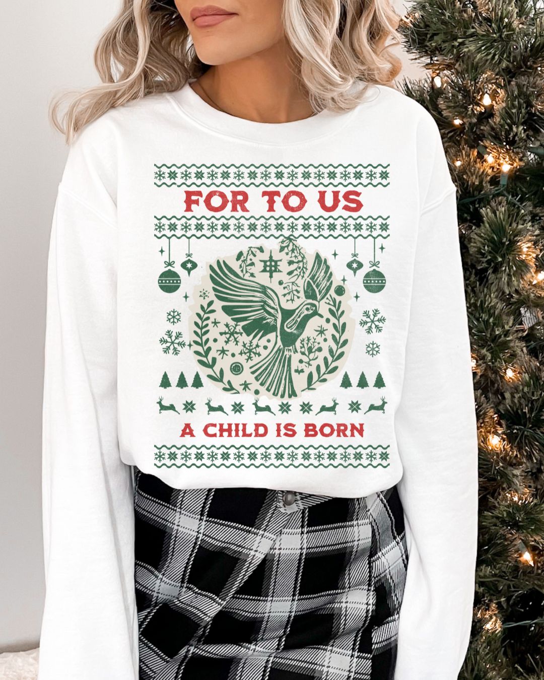 Woman wearing For To Us a Child Is Born Christian Christmas sweater with dove and festive design.