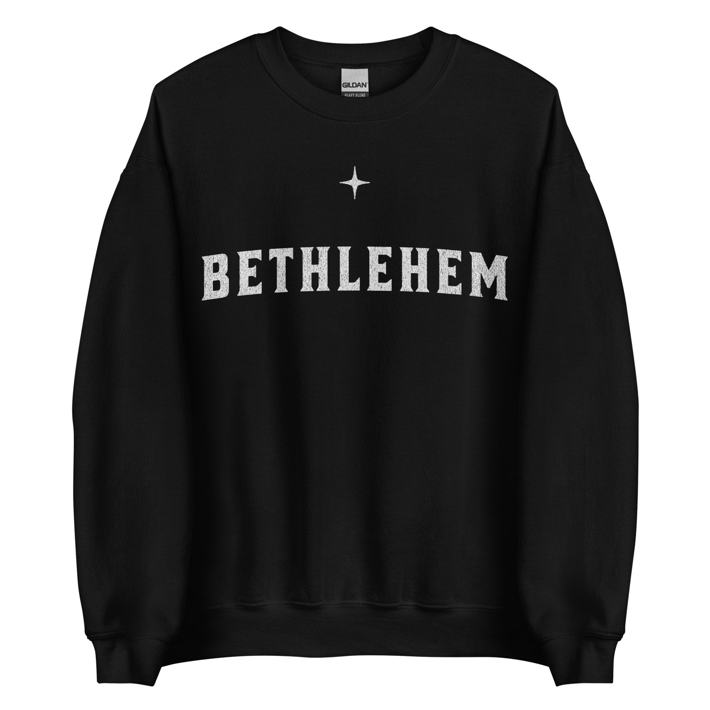 Woman wearing dark green Bethlehem Christian Christmas sweater with simple star design.