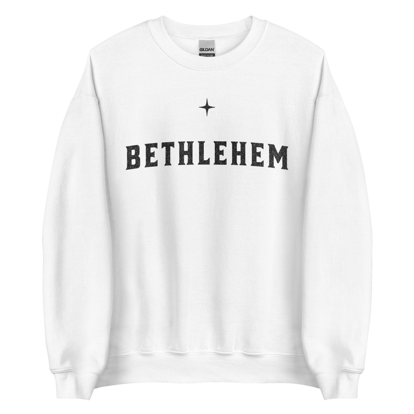Woman wearing dark green Bethlehem Christian Christmas sweater with simple star design.