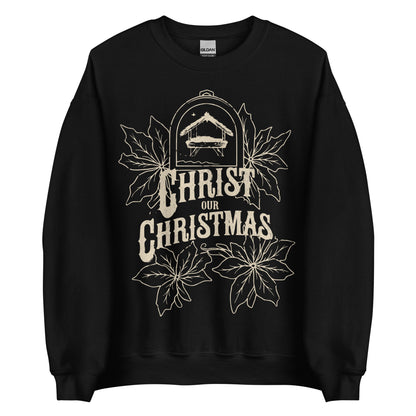 Woman wearing burgundy Christ Our Christmas sweater with manger and poinsettia design.