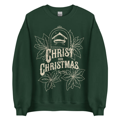 Woman wearing burgundy Christ Our Christmas sweater with manger and poinsettia design.