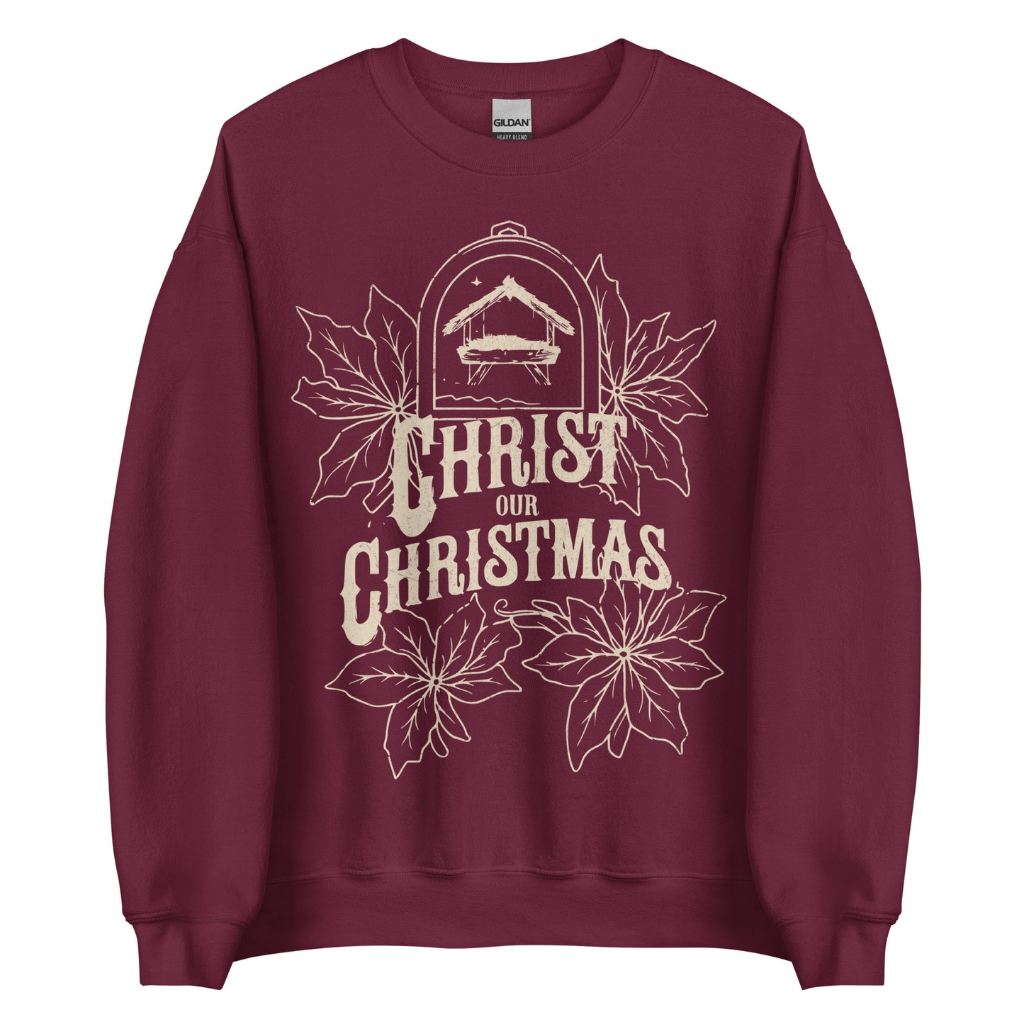 Woman wearing burgundy Christ Our Christmas sweater with manger and poinsettia design.