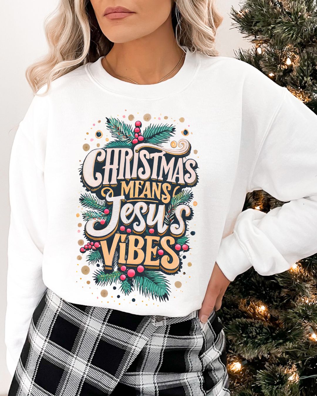 Woman wearing white Christmas Means Jesus Vibes Christian sweater with festive holly and pine design.