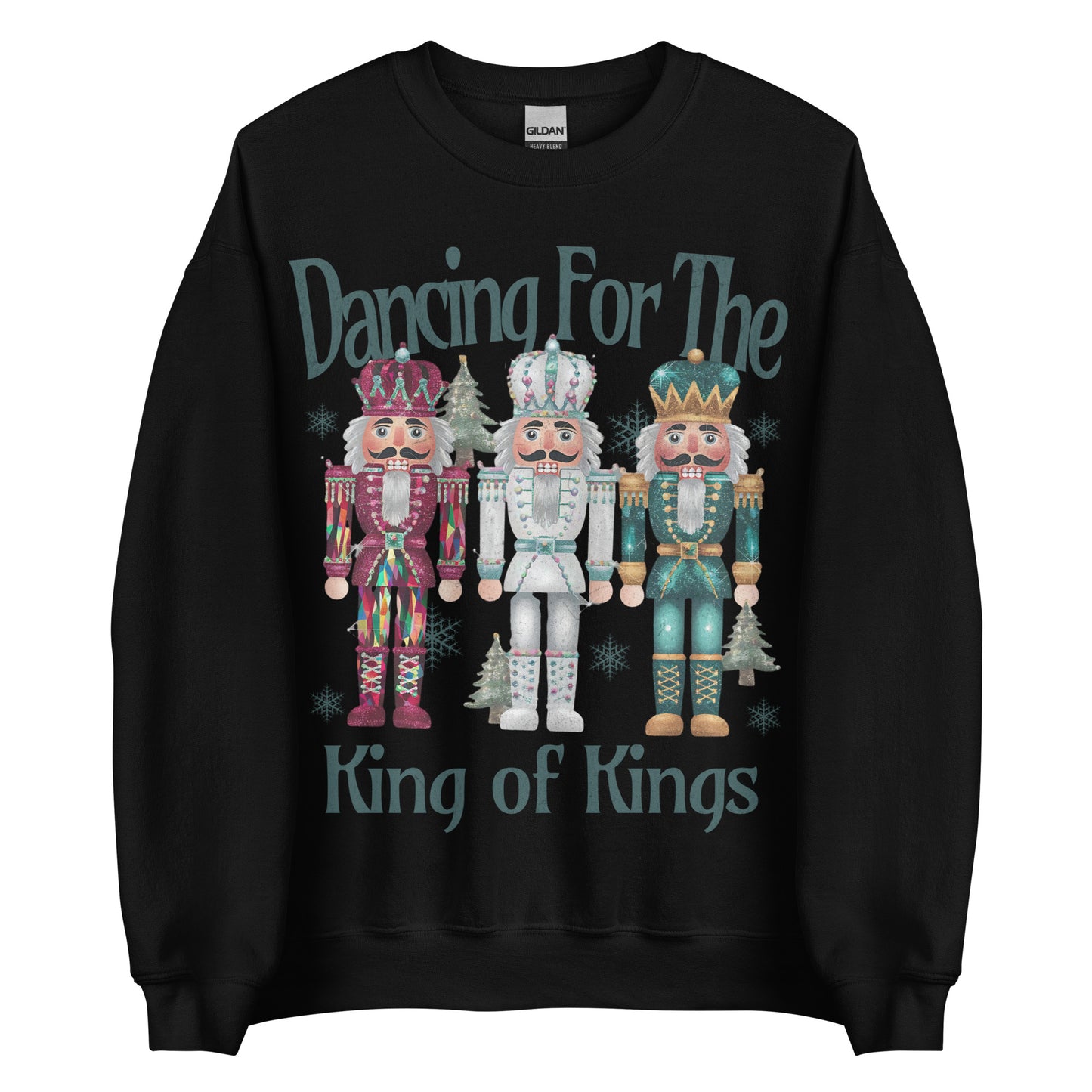 Woman wearing Dancing for the King of Kings Christian Christmas sweater with three colorful nutcracker figures.