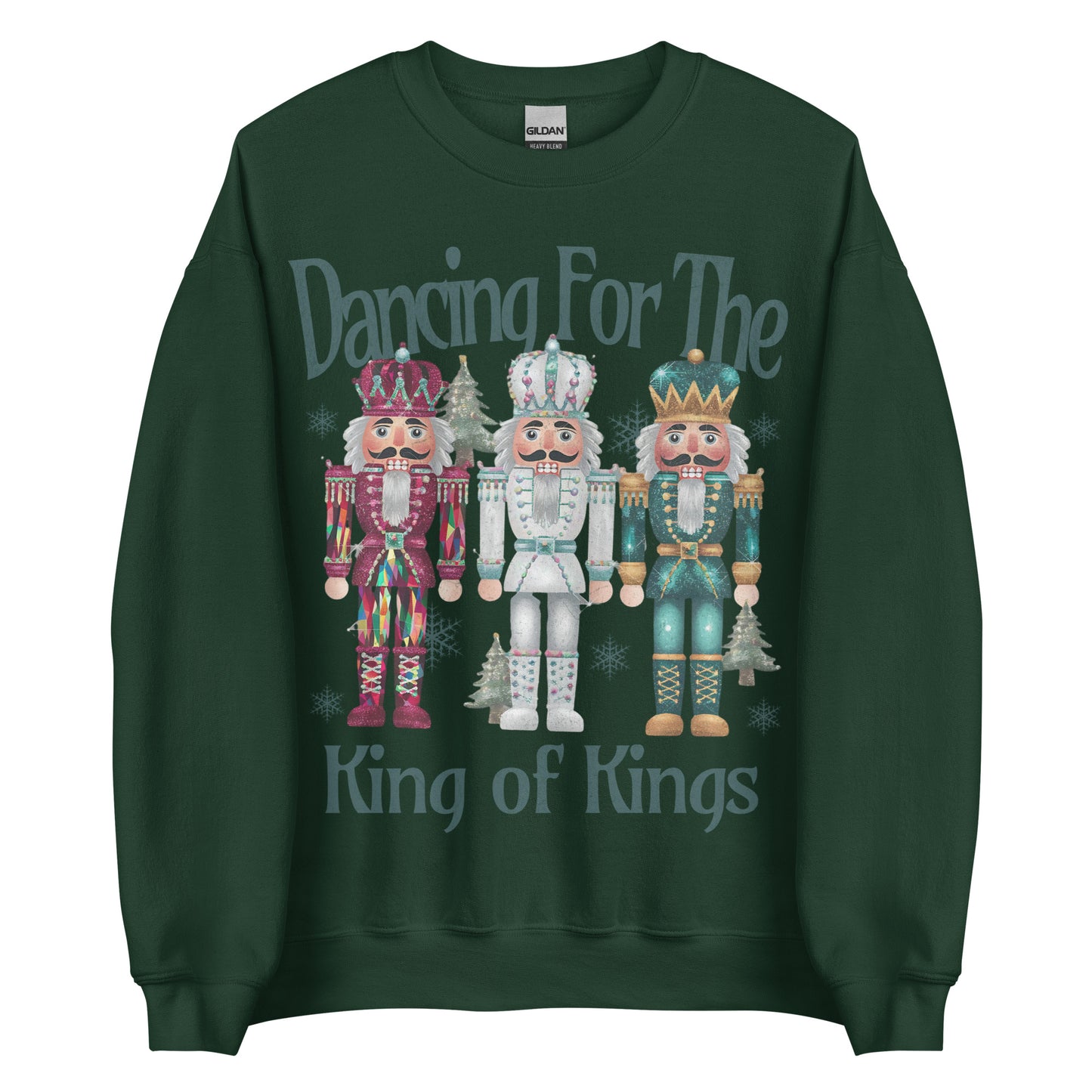 Woman wearing Dancing for the King of Kings Christian Christmas sweater with three colorful nutcracker figures.