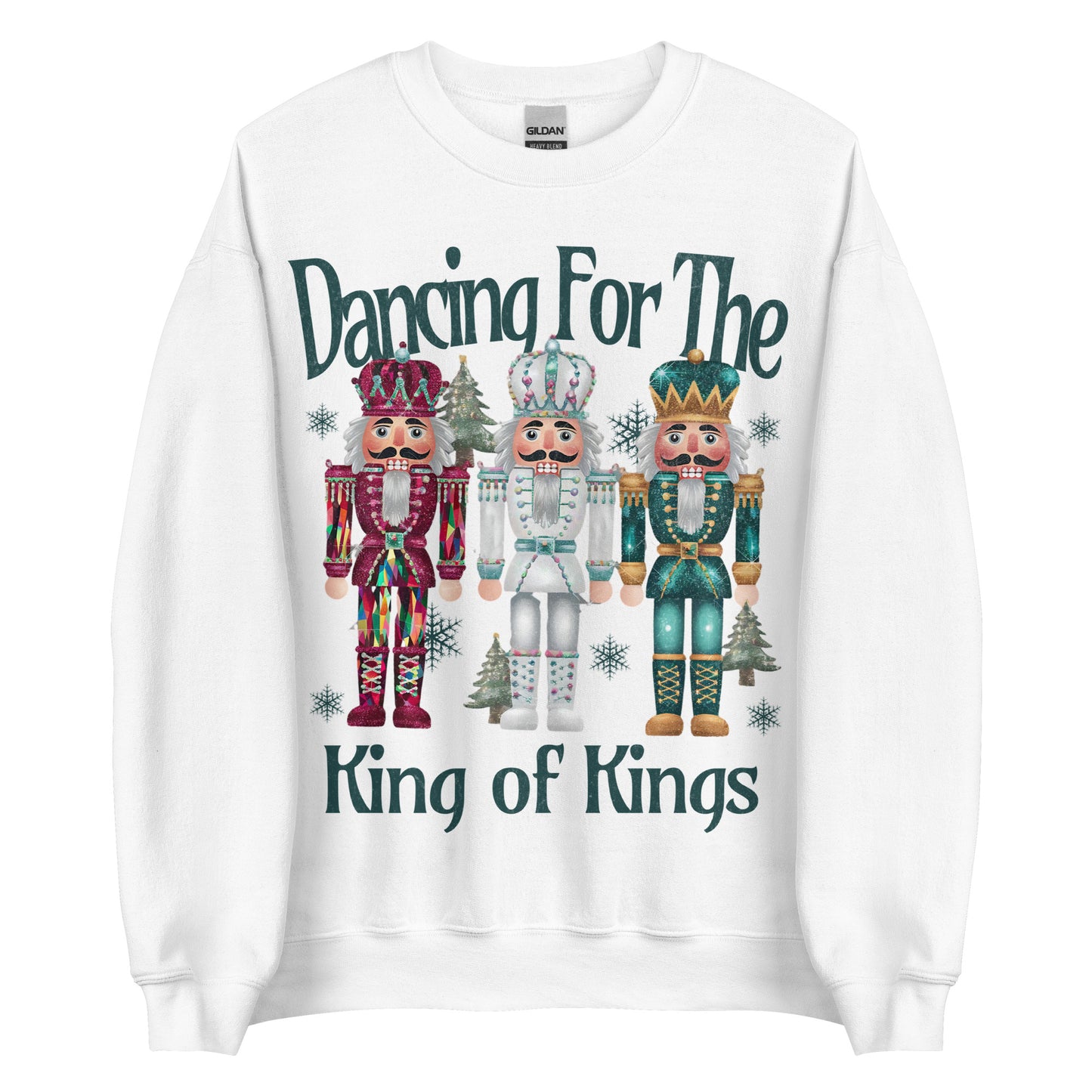 Woman wearing Dancing for the King of Kings Christian Christmas sweater with three colorful nutcracker figures.