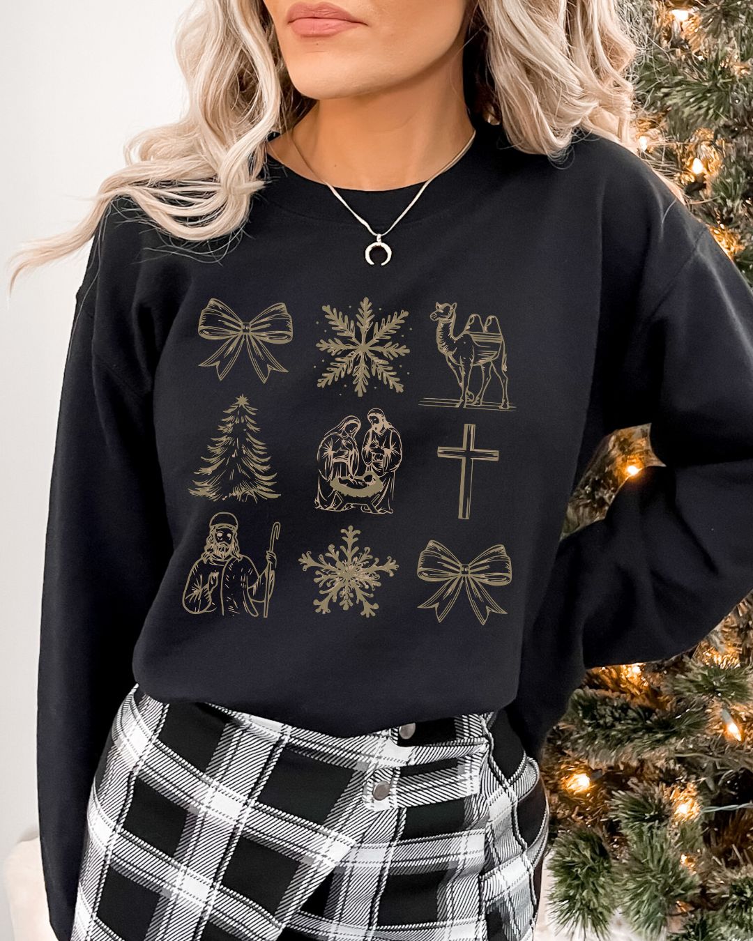 Woman wearing Holy Night Icons Christian Christmas sweater with nativity, cross, camel, shepherd, and festive gold detailing.