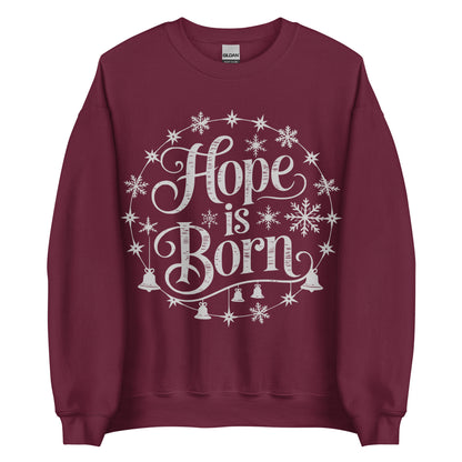 Woman wearing burgundy Hope Is Born Christian Christmas sweater with snowflake and star design.