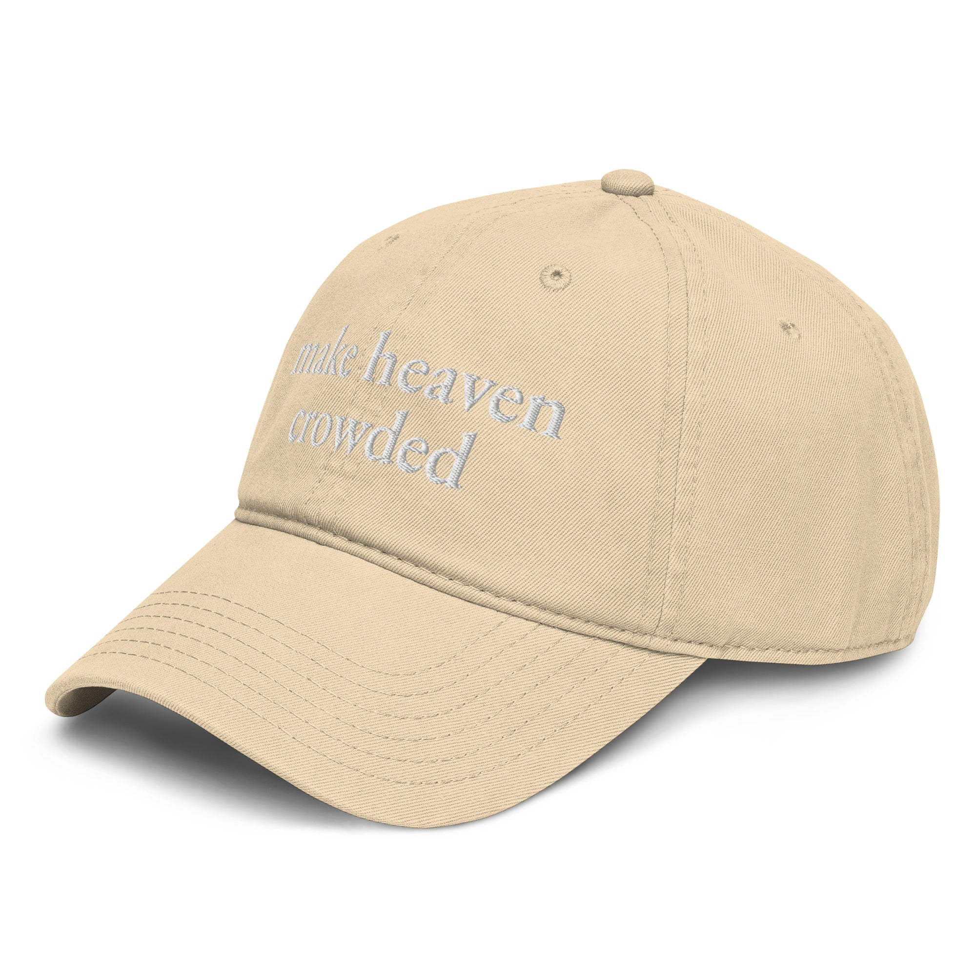 Woman wearing beige Make Heaven Crowded embroidered Christian baseball cap with neutral outfit.