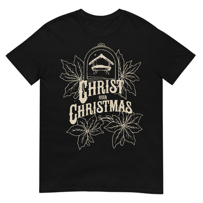 Woman wearing Christ Our Christmas Christian T-shirt with nativity design and poinsettias — faith-based apparel celebrating Jesus this holiday.
