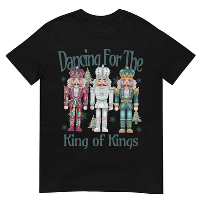 Woman wearing Dancing for the King of Kings Christian Christmas T-shirt with festive nutcracker design — joyful faith apparel celebrating Jesus.