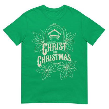 Woman wearing Christ Our Christmas Christian T-shirt with nativity design and poinsettias — faith-based apparel celebrating Jesus this holiday.
