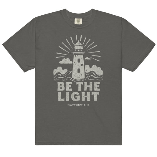 Faith apparel with lighthouse design and Matthew 5:14 scripture. Christian t-shirt reminding women to shine their light in faith