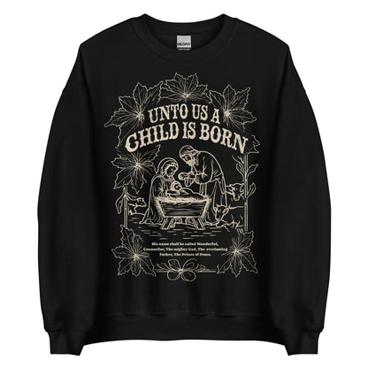 Woman wearing black Unto Us a Child Is Born Christian Christmas sweater with nativity scene and poinsettia design.