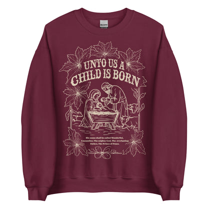 Woman wearing black Unto Us a Child Is Born Christian Christmas sweater with nativity scene and poinsettia design.